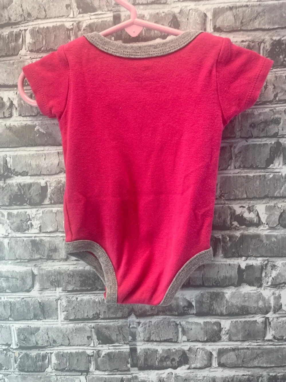 Nike Pink and  White Logo Infant Bodysuit‎ Wall Display